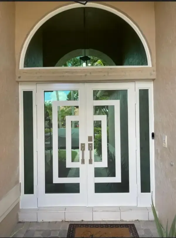 Arched impact entry door with decorative glass in Wellington