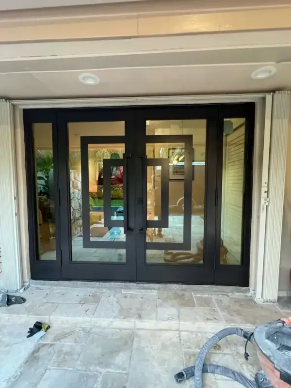 Double impact entry doors with sidelights in Coral Gables