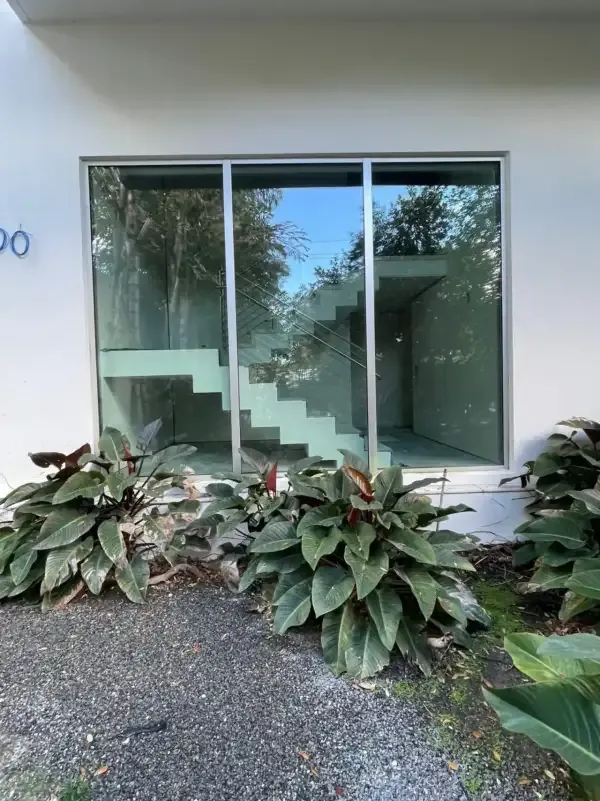 Fixed impact windows with tropical landscaping in Jupiter, FL