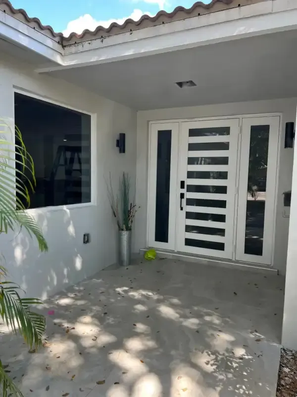 Modern impact entry door with sidelights in Doral, FL