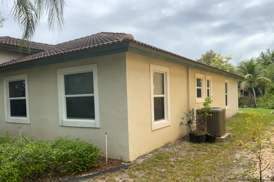 Single hung impact windows along two elevations of a South Florida home, each with a horizontal meeting rail