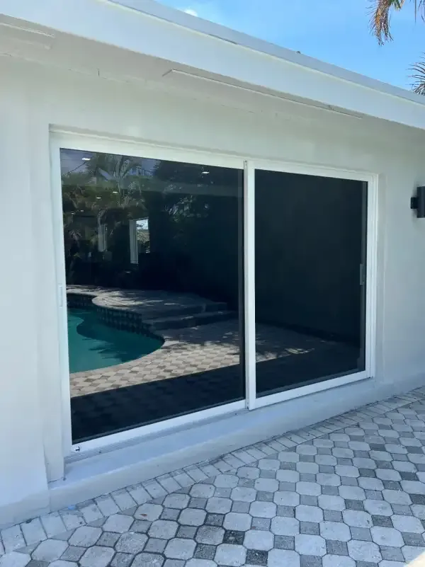 Large impact sliding window overlooking pool in Delray Beach