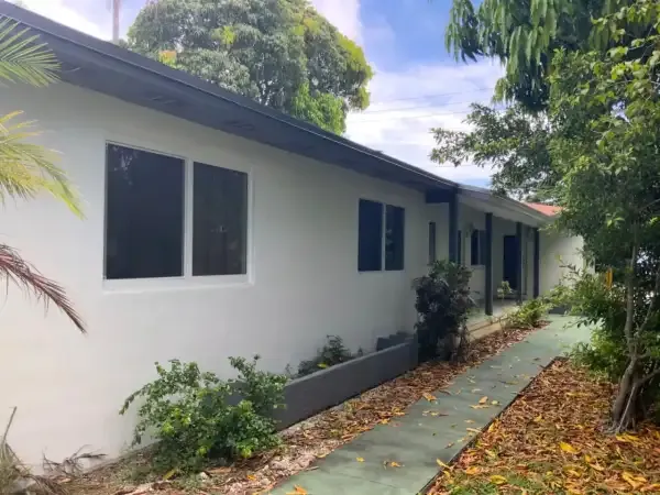 Whole-house horizontal roller impact window installation on a South Florida home